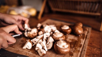 Diet Nutrition: closeup chopping mushrooms 1064080722