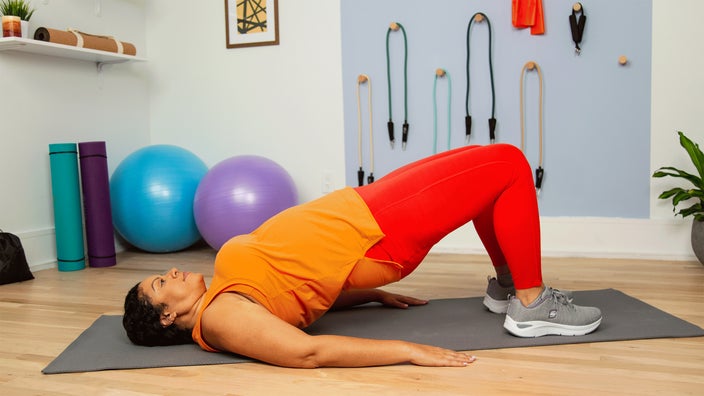 woman doing glute bridge stretch HERO 2400