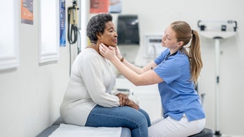 Thyroid: patient having thryoid examined 1480979555