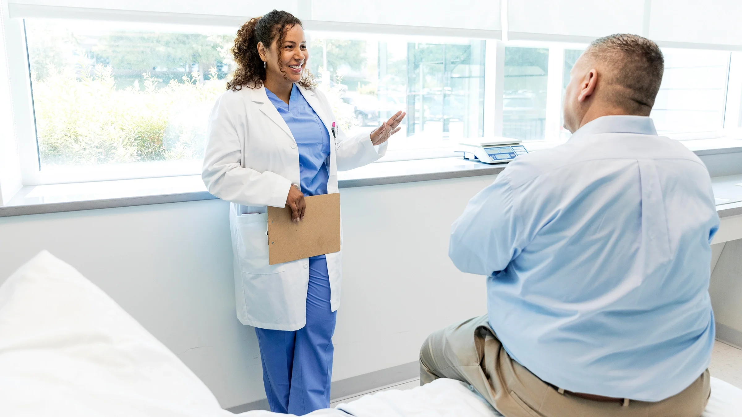 A doctor speaking to a patient.