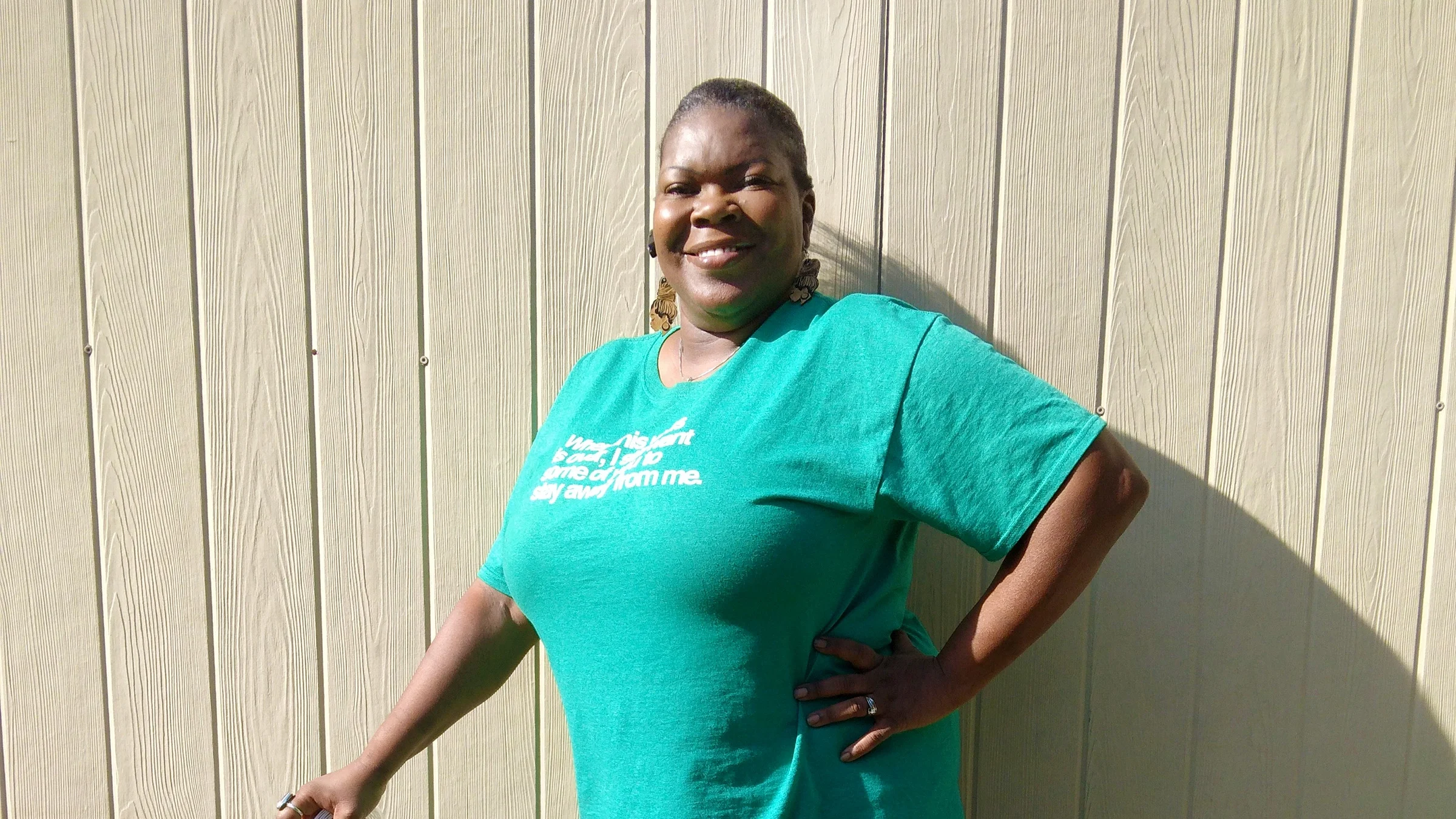 Vanessa Scott smiling with her hand on her hip.