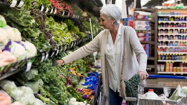 Supplements and herbs: senior woman shopping for produce 1168467597