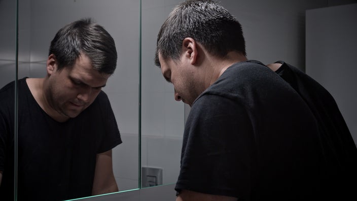 Man upset in the bathroom