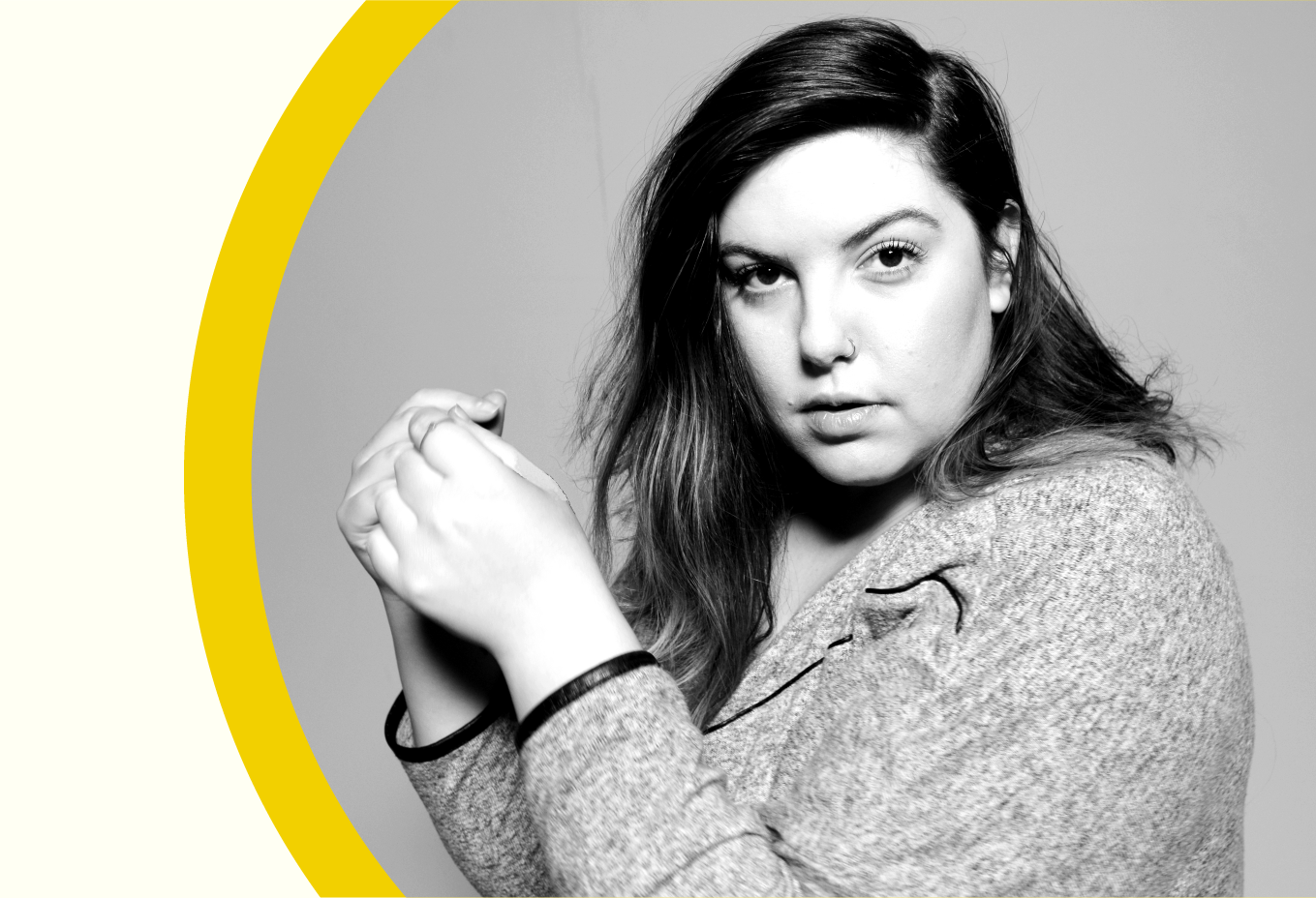 Black-and-white portrait of singer-songwriter and fat activist Mary Lambert, indoors.