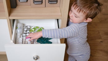 Children's health: child reaching into medicine drawer 1476714535