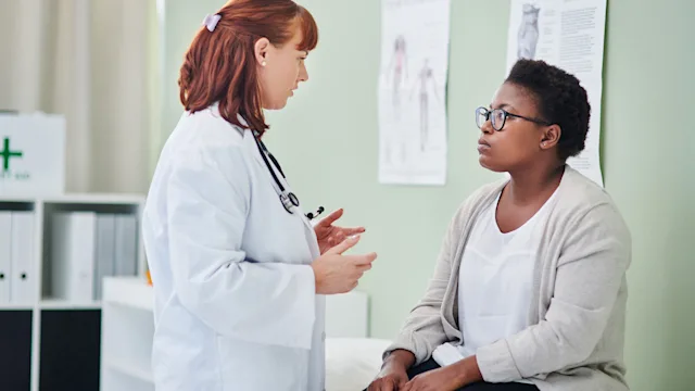 weight-loss: doctor speaking to patient 1328086453