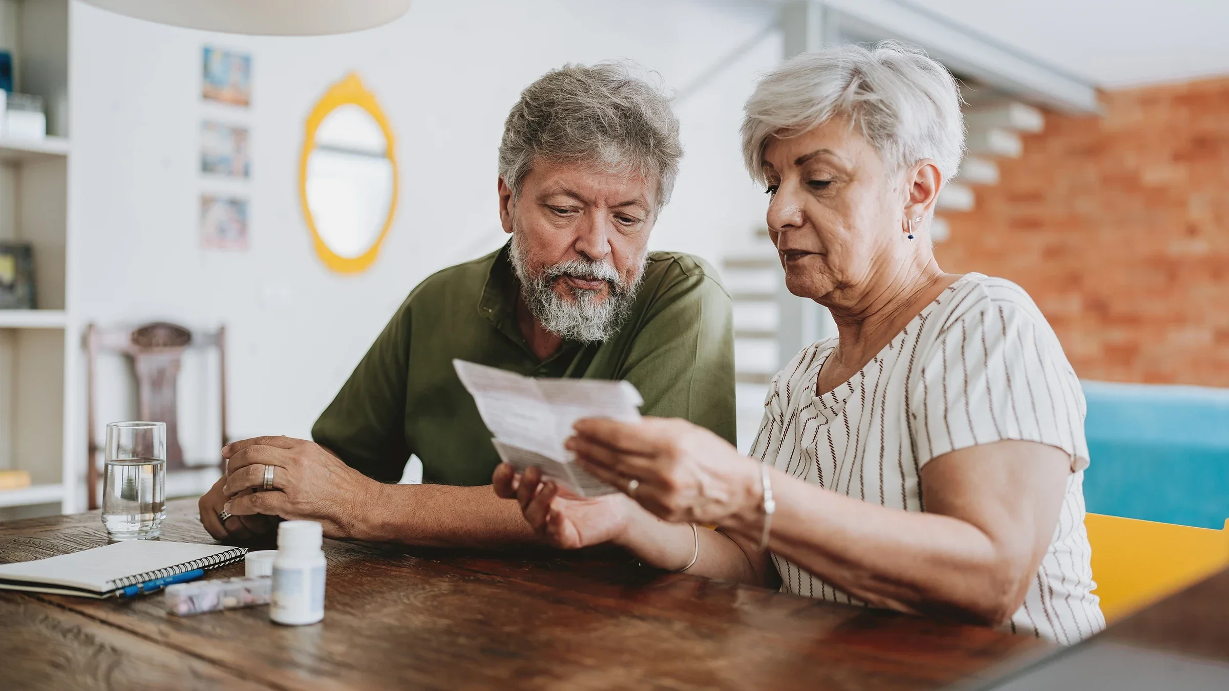 A couple read about a prescription.
andreswd/E+ via Getty Images