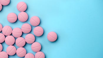 Health: Clopidogrel: pink-pills-on-blue-background-1035411124