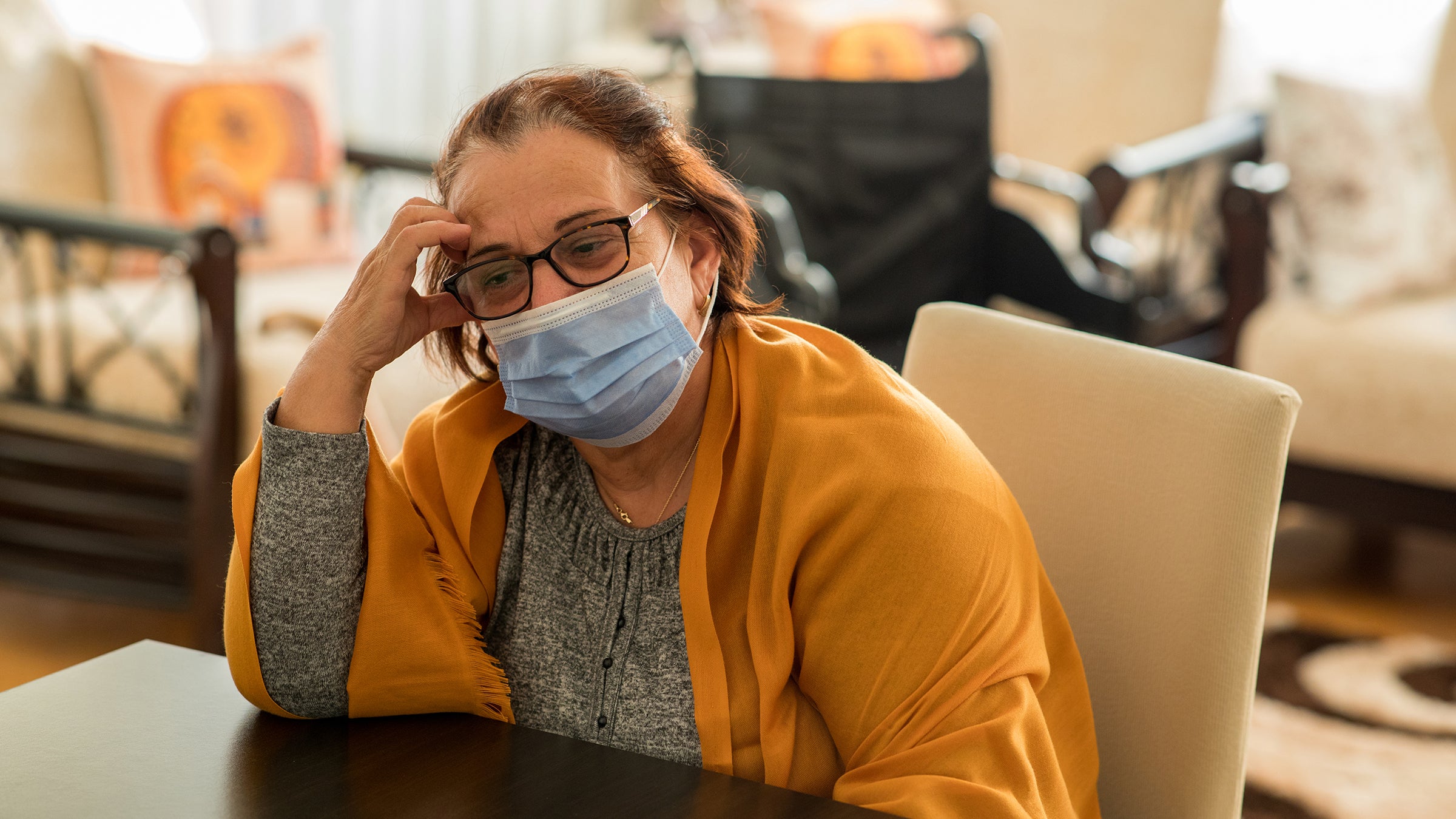 covid: senior woman wearing a mask 1289058995