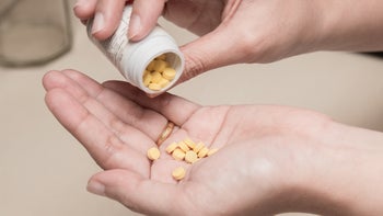 Health: Risperidone: pills pouring into hand-813187296