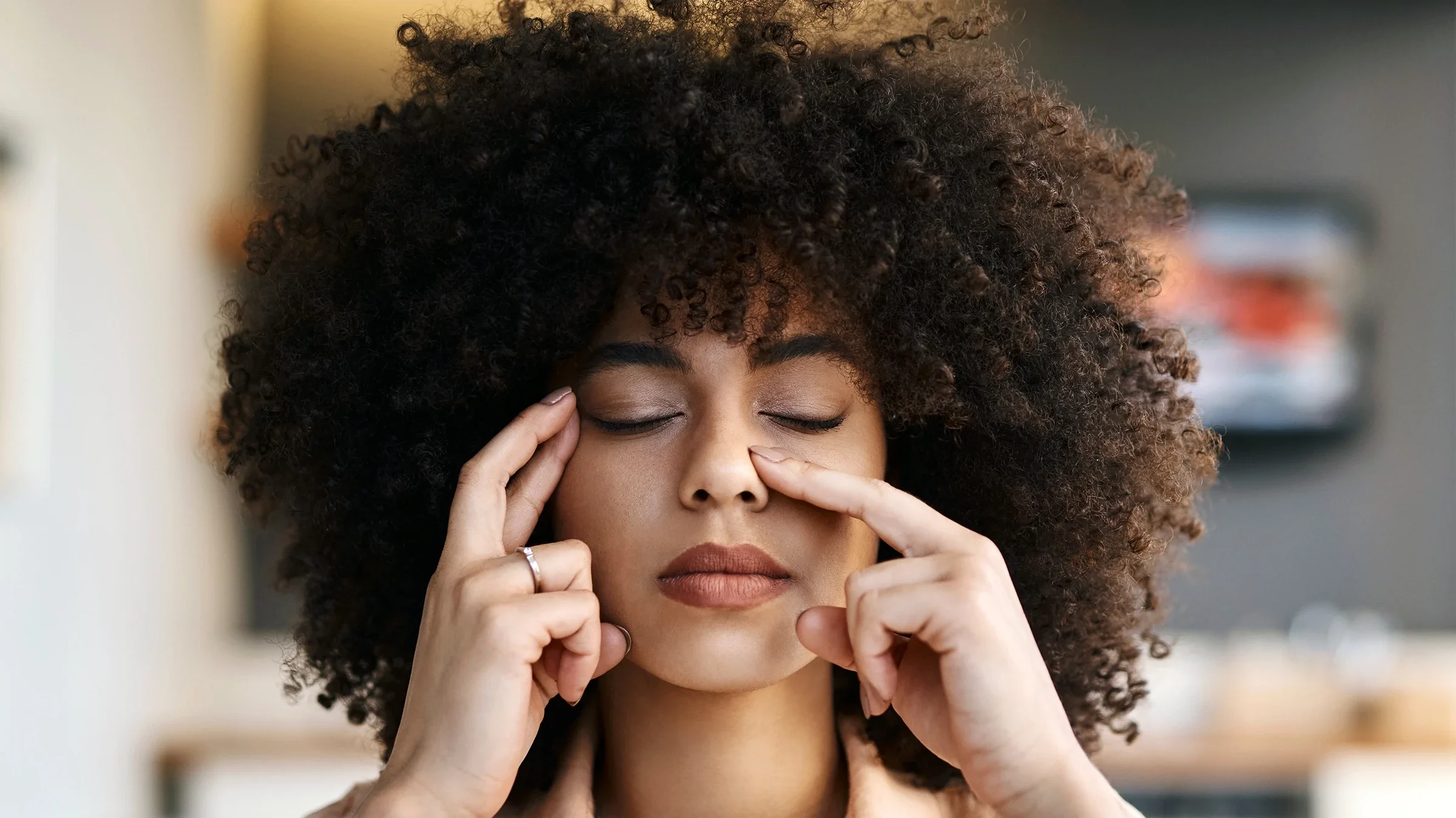 Woman experiencing a sinus headache