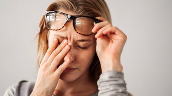 Eye: woman with eye pain 2220570668