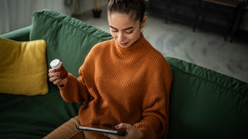 melatonin: woman researches medication on internet 1958382063
