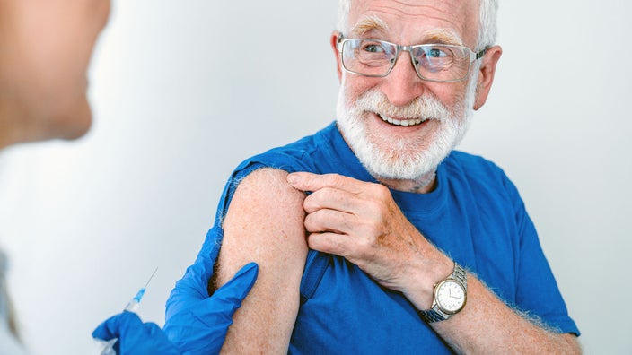 enior patients preps for vaccine shot.
