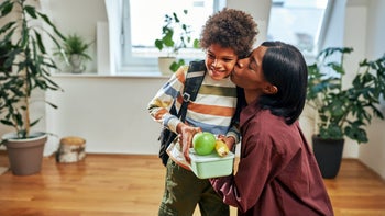 Health: Childrens health: mother kissing son on cheek 1394555041