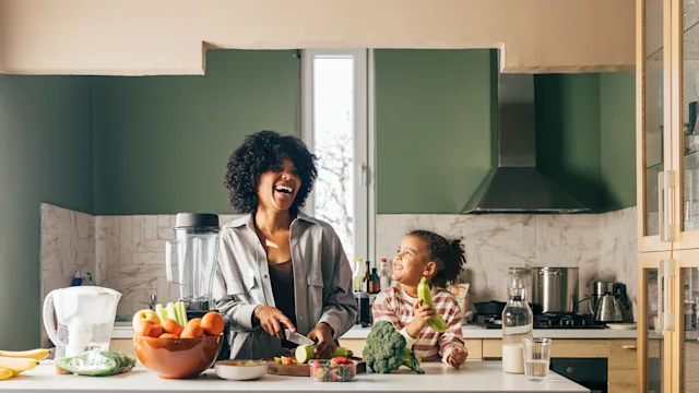 Diet nutrition: mom daughter cutting vegetables 1367672344