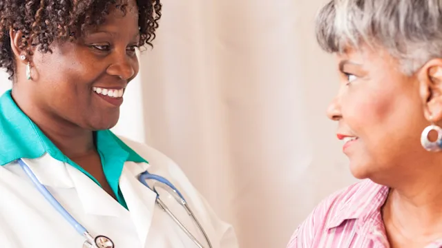 Osteoporosis: Osteopenia: close up talking to older patient-639032336