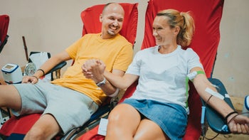 Patient advocacy: Blood: couple holding hands donating blood-1336682364
