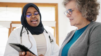 Osteoporosis: doctor explaining test results 1604725509