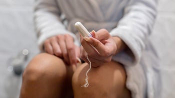 Infections: Toxic shock syndrome: holding tampon on toilet 1124477597