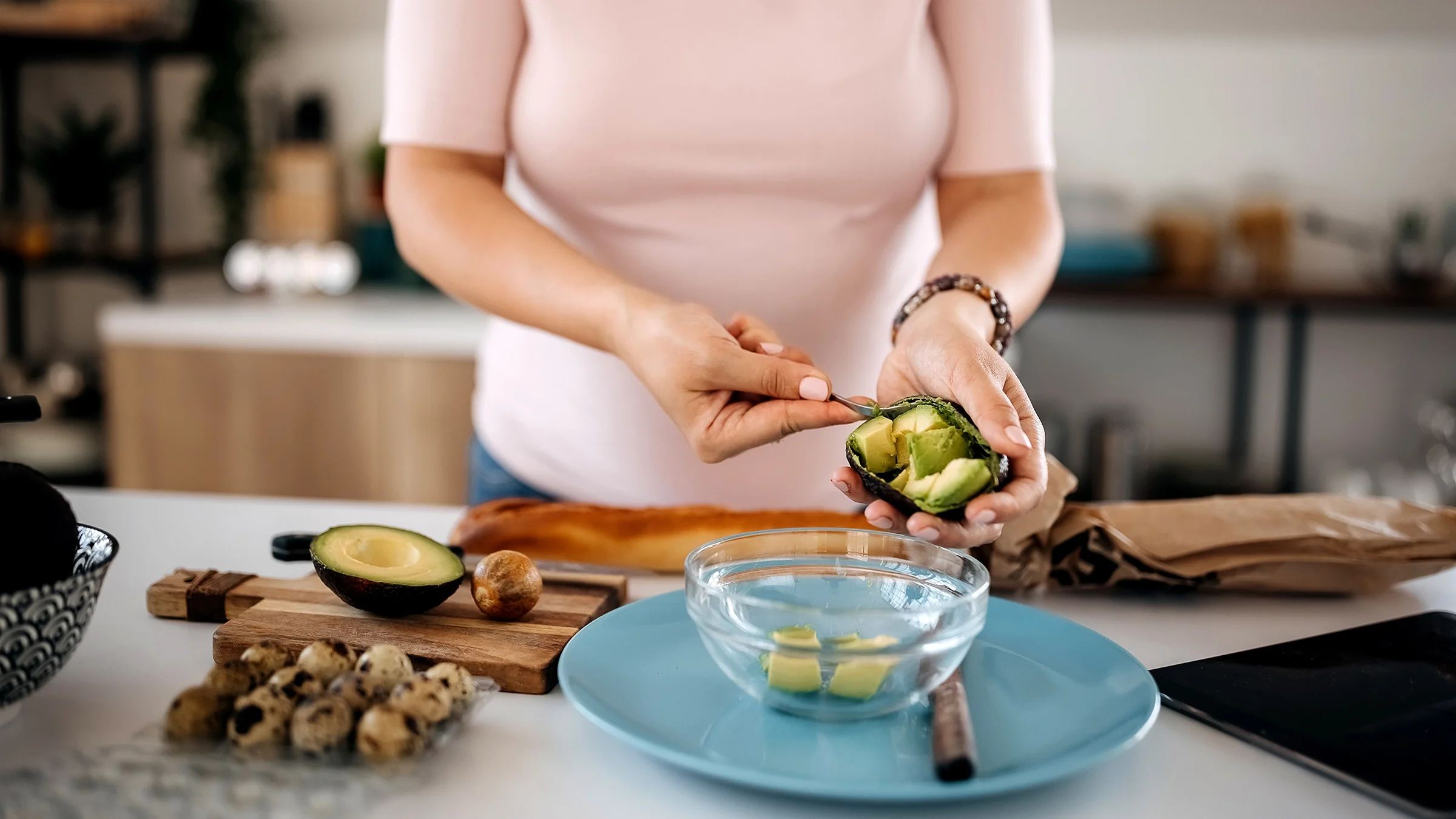 Close-up cutting avocado.