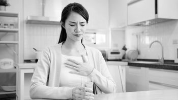 omeprazole: black and white woman with heartburn 1370424220