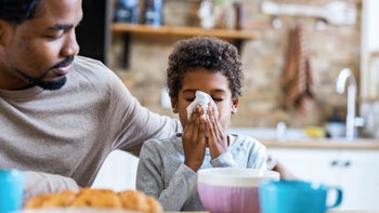 Health: Covid-19: father taking care of sick son 1310384321