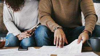 Weight loss: closeup couple doing paperwork 1165046693