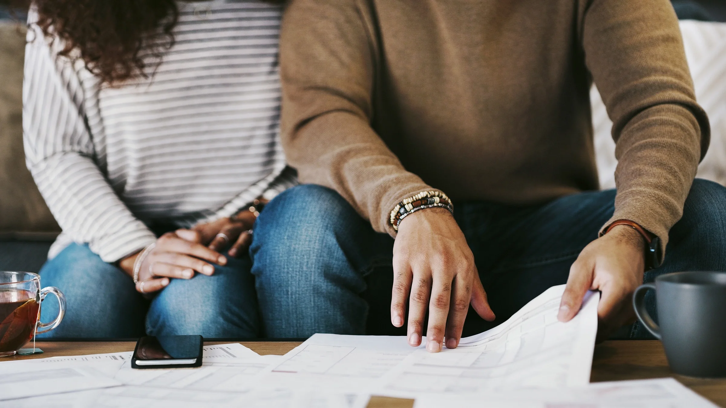 A close-up of a couple doing paperwork.