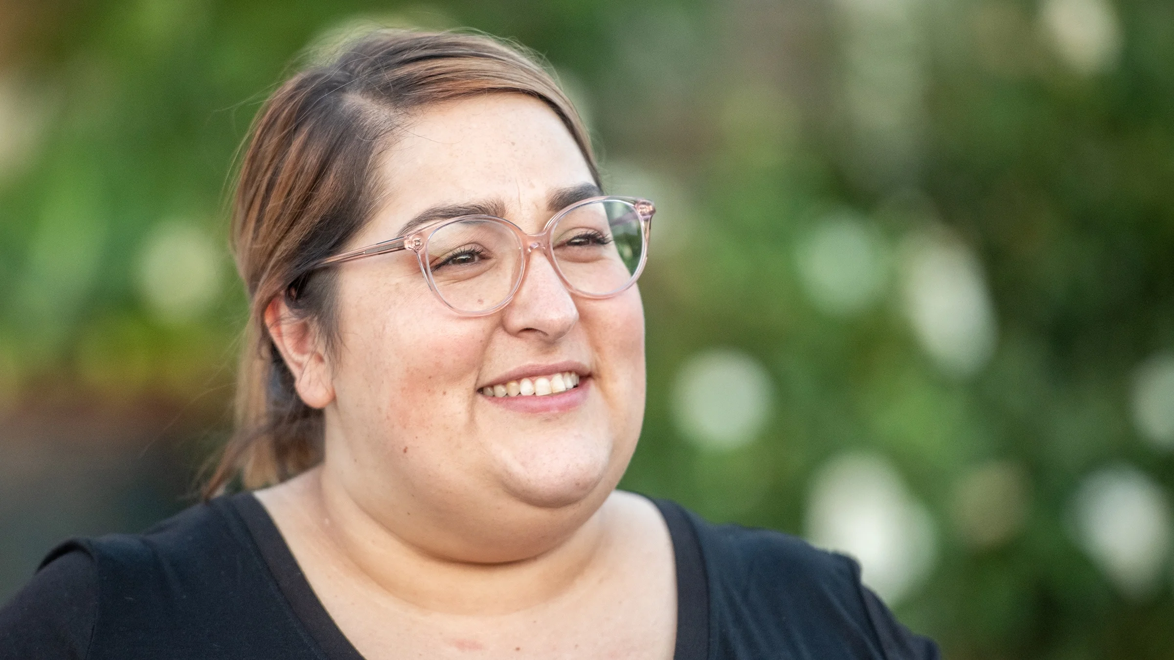 Close-up portrait of a young cute woman with glasses.