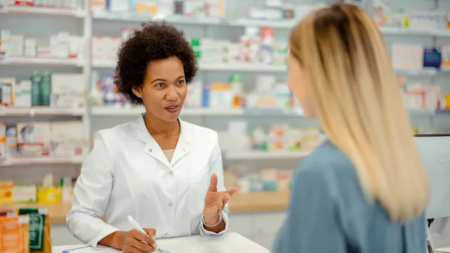 weight-loss: customer speaking to pharmacist 1587893034