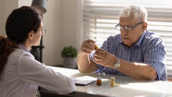 Atrial fibrillation: doctor patient discussing different meds 1319103317
