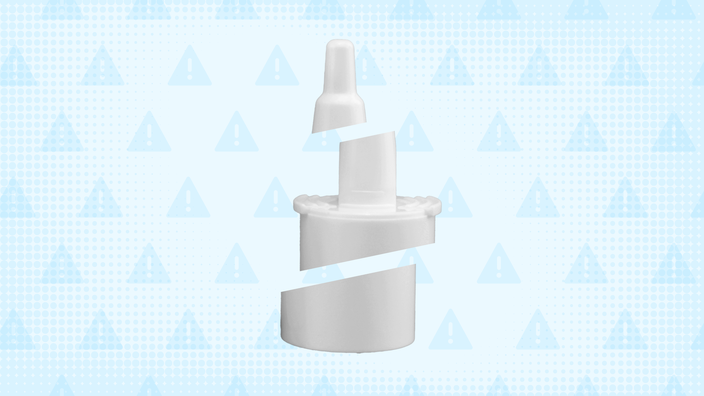 In the center of a light blue background with texture and warning sign pattern is a white nasal spray bottle cut into thirds. 