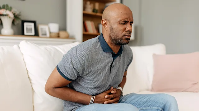 Irritable-bowel-syndrome: man with stomach pain 2163434816
