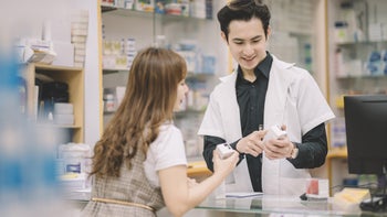 Naloxone: Zimhi vs narcan: pharmacist explaining products at counter 1212188698