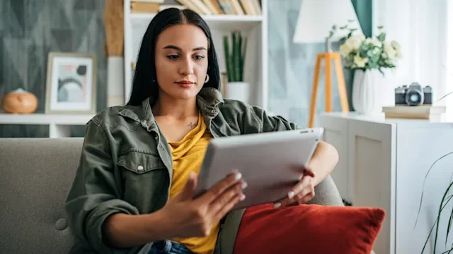 HCP: woman reading a tablet 2159492959