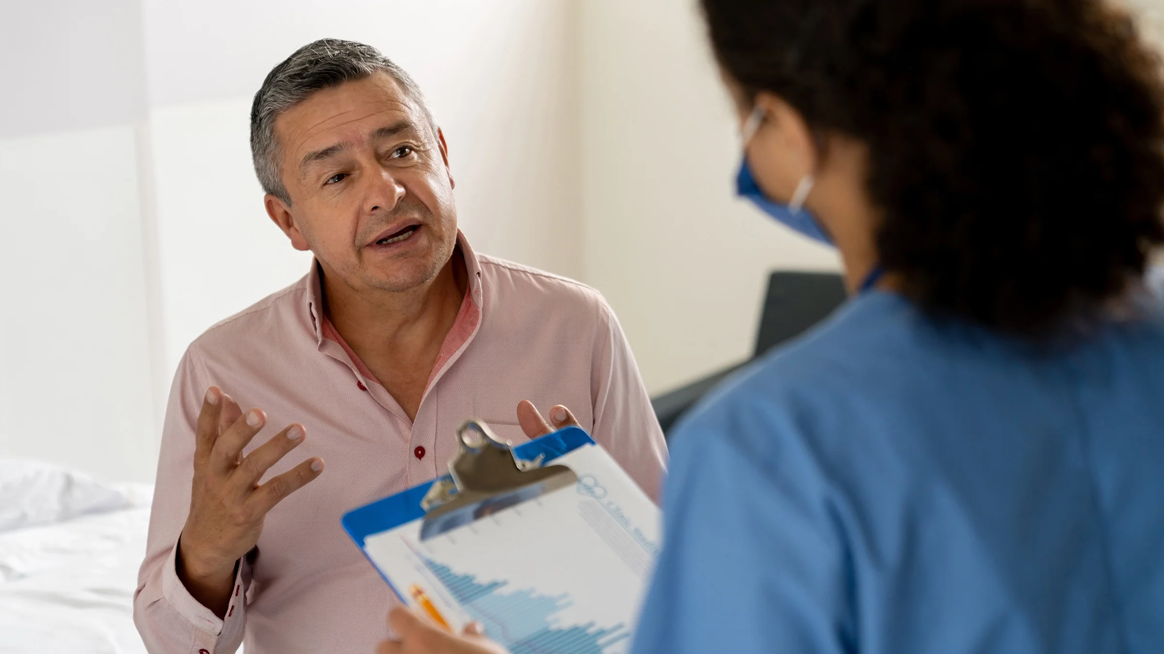 A patient asks a question during their medical appointment.