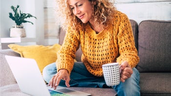 Patient advocacy: Lab test accuracy: on couch looking at laptop 1087959426