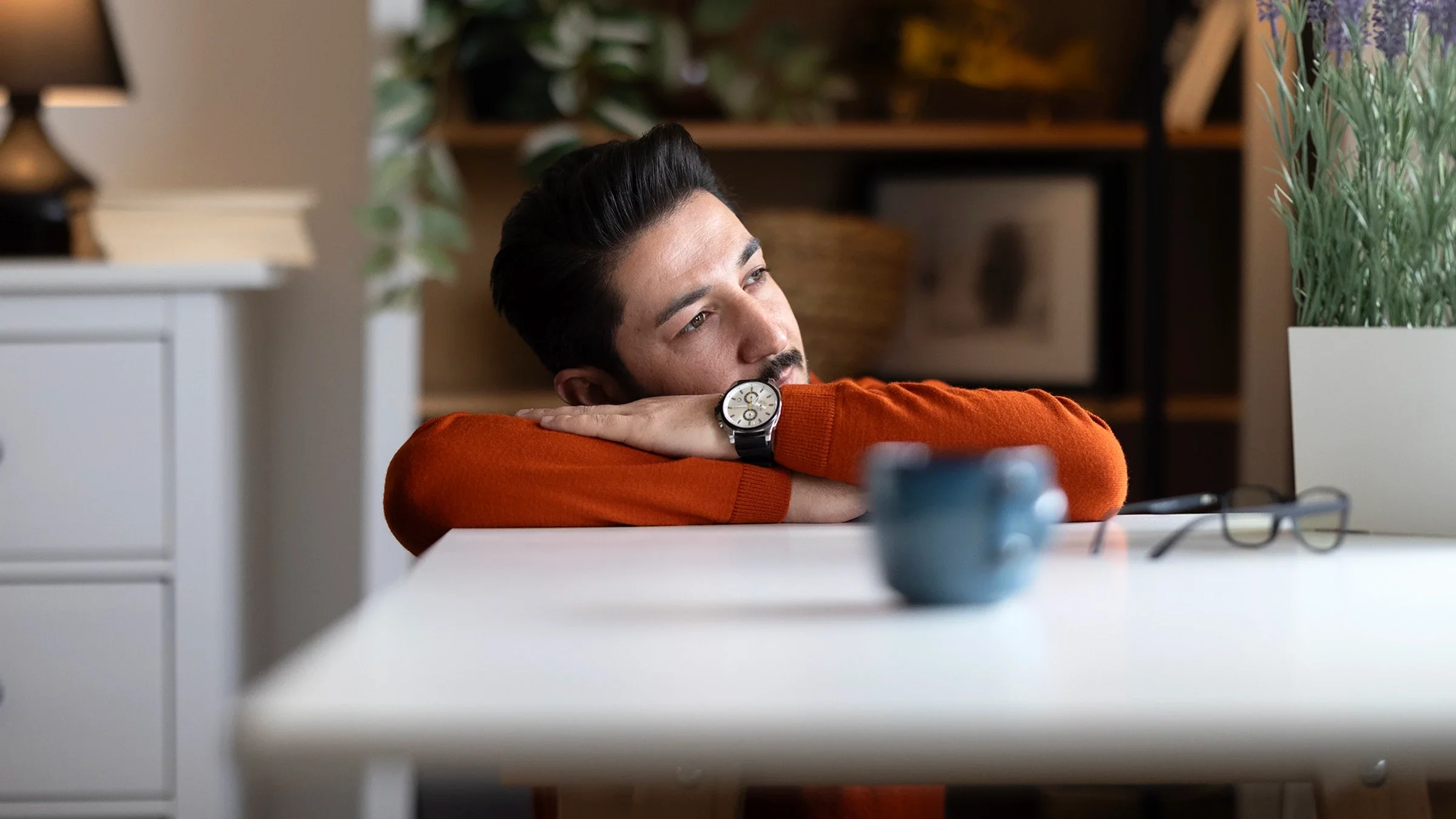 Man staring outside of the window