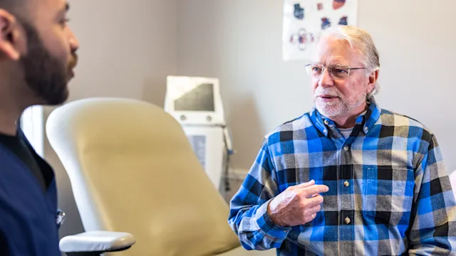 Erectile dysfunction:  man at medical appointment 2206425856