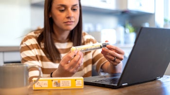 Epinephrine-epipen: woman researching EpiPen 2150701471