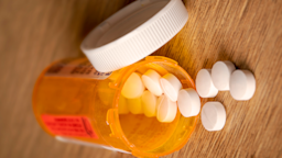 A pill bottle with a warning label on it.
sdominick/iStock via Getty Images Plus  