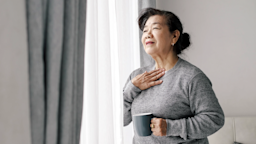 A woman takes a deep breath.
nuiiko/iStock via Getty Images Plus