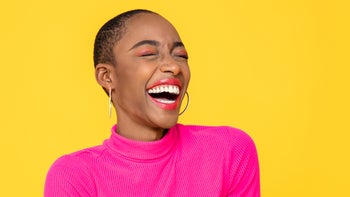 portrait of extremely smily woman in pink-1256141368
