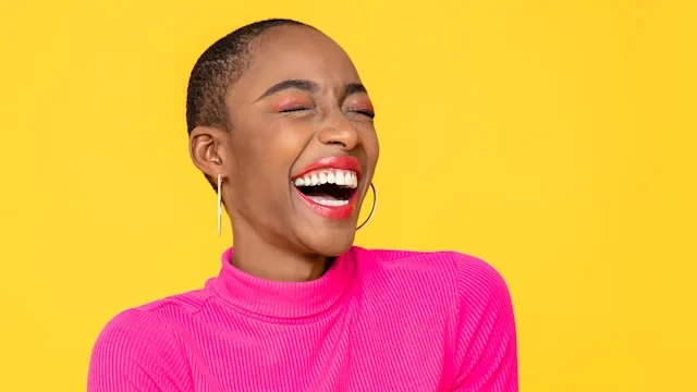 portrait of extremely smily woman in pink-1256141368