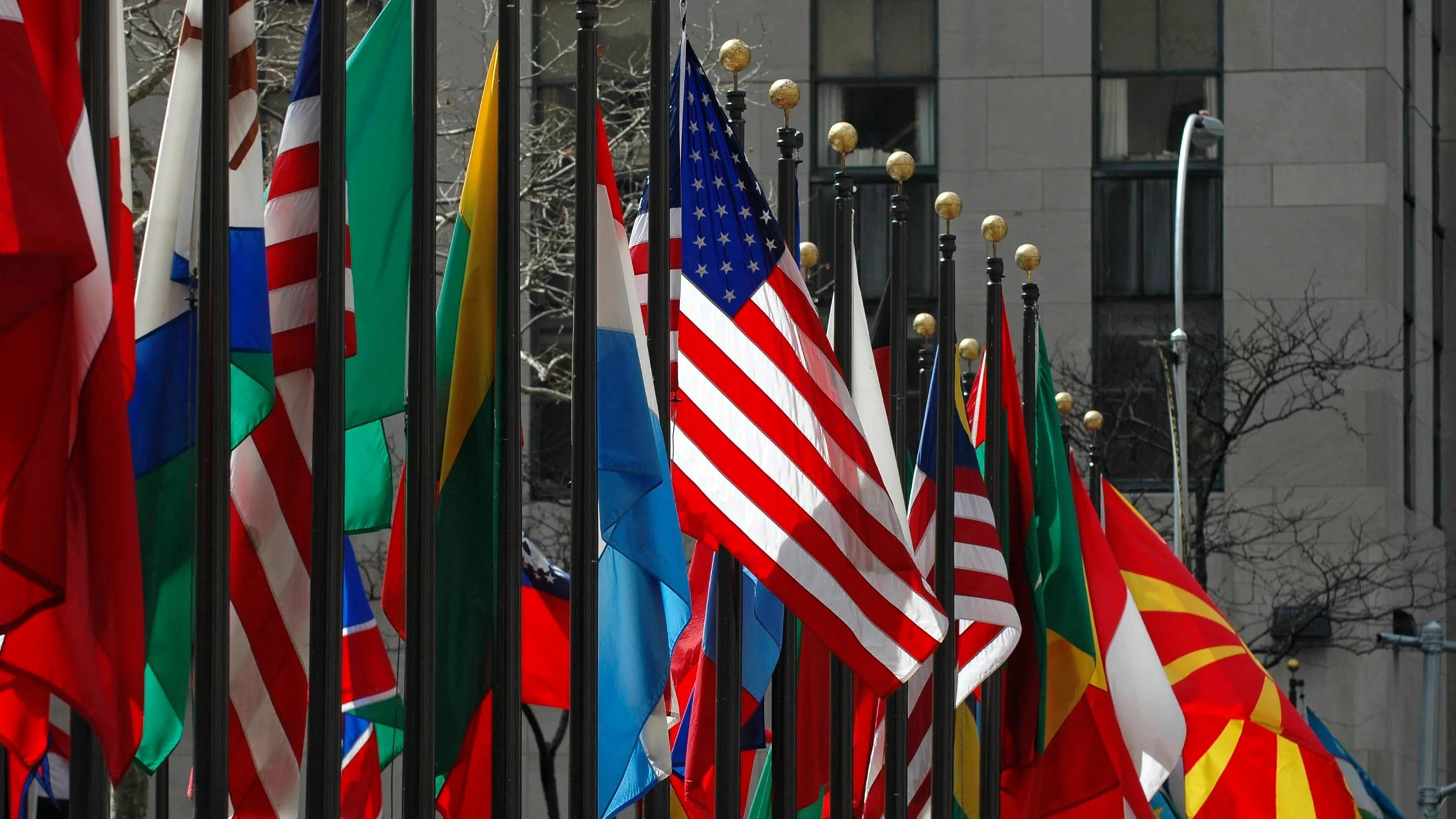 Various nations' flags, with a focus on the American one.