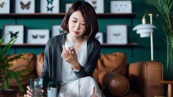 Gabapentin: Interactions: woman reading Rx label 1365749374