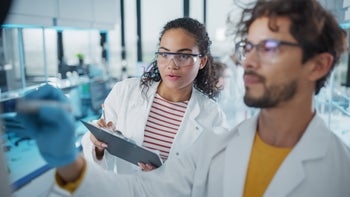 Research: Types of studies: researcher-writes-on-board-in-medical-lab-1346675624