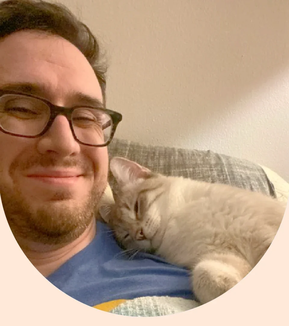 Joey Lusvardi is pictured with his cat, Poutine.