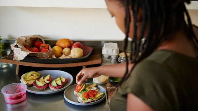 glp-1-agonist: woman preparing avocado toast 1281597344